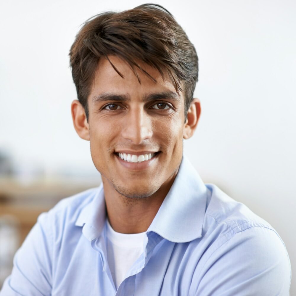 Savvy businessman. A handsome young smiling businessman.